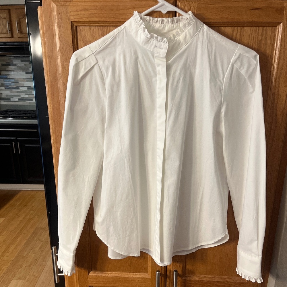White blouse with ruffle trim